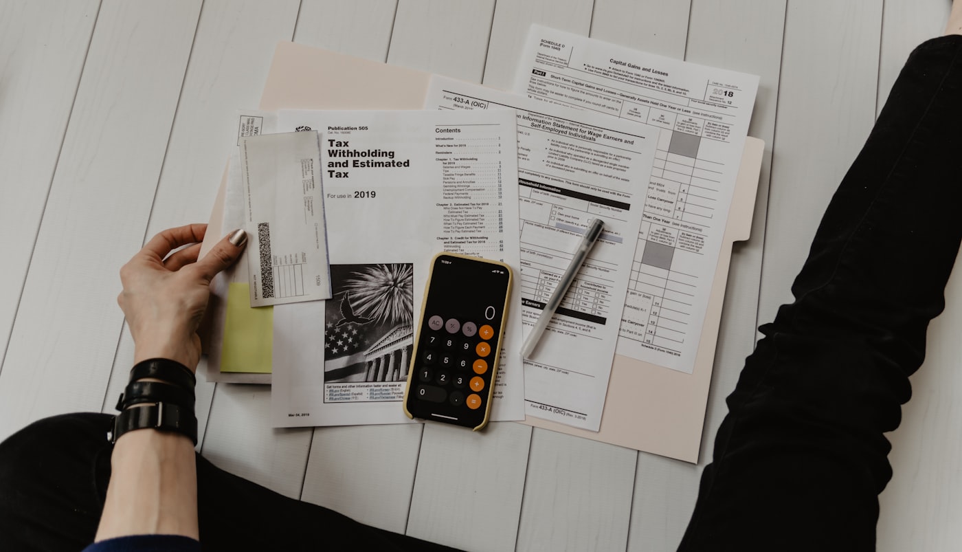 Calculator and paperwork used for cash-pay medication cost research.