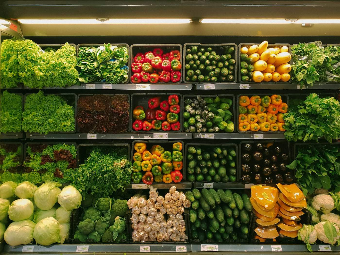 Bright produce aisle in a grocery store.